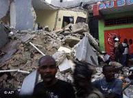 People carry an injured person after an earthquake in Port-au-Prince, Haiti,  