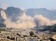 Plumes of dust rise from landslides caused by a strong earthquake
